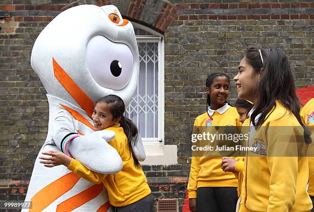 Wenlock, the Olympic mascot receives a hug from a school girl after being unveiled at St Pauls Whitechapel C of E Primary School, Tower Hamlets on...