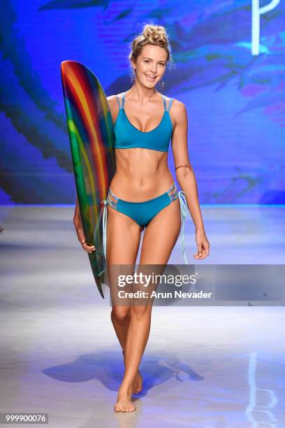 Model walks the runway for Pikai Swimwear at Miami Swim Week powered by Art Hearts Fashion Swim/Resort 2018/19 at Faena Forum on July 15, 2018 in...