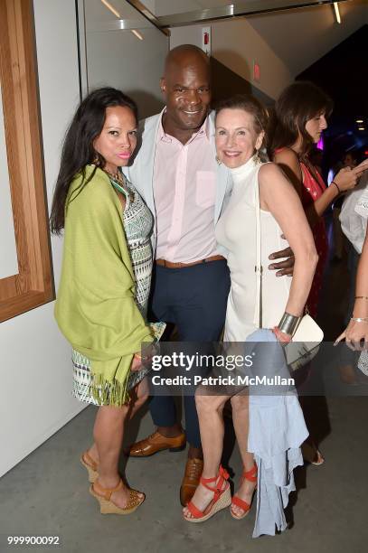 Rolise Rachel, Ron Meyers, and Julie Ehret attend the Parrish Art Museum Midsummer Party 2018 at Parrish Art Museum on July 14, 2018 in Water Mill,...