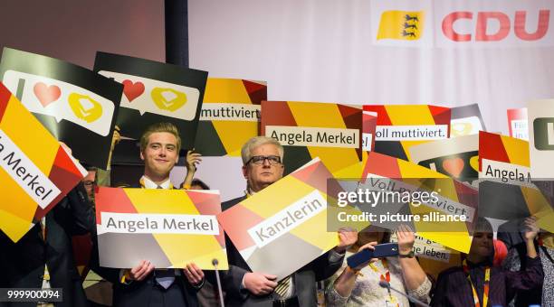 Party members hold placards in the colour of the German flag at the party's convention in Reutlingen, Germany, 9 Septmeber 2017. The event was...