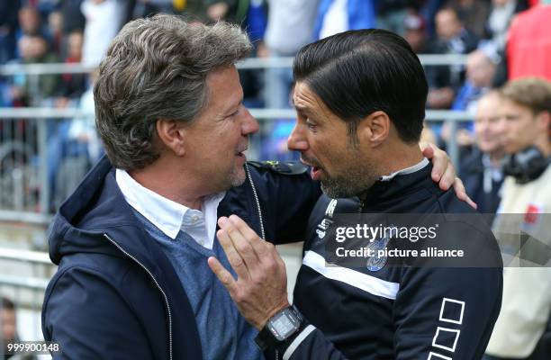 Bielefeld's manager Jeff Saibene with his counterpart from Duisburg Ilia Gruev during the German 2nd Bundesliga soccer match between Arminia...