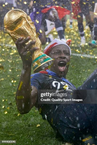 Benjamin Mendy of France celebrates the victory with the trophy after the 2018 FIFA World Cup Russia Final between France and Croatia at Luzhniki...