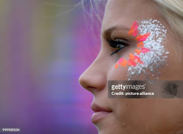 Woman wears glitter make-up at the Lollapalooza festival in Hoppegarten, Germany, 9 September 2017. The music festival is held over two days on the 9...