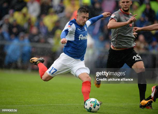 Kiel's Steven Lewerenz shoots at goal during the German 2nd Bundesliga soccer match between Holstein Kiel and 1. FC Kaiserslauternin the Holstein...