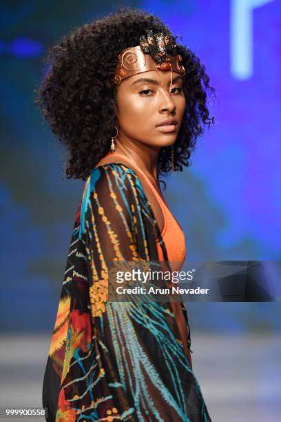 Model walks the runway for Pikai Swimwear at Miami Swim Week powered by Art Hearts Fashion Swim/Resort 2018/19 at Faena Forum on July 15, 2018 in...