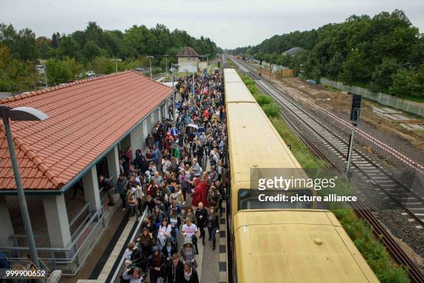 Visitors at the train station near the Lollapalooza festival in Hoppegarten, Germany, 9 September 2017. The music festival is held over two days on...