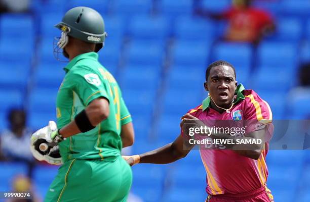 West Indies cricketer Jerome Taylor celebrates after dismissing South African batsman Loots Bosman during the first T20 match between West Indies and...