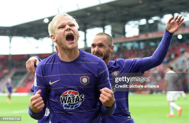 Aue's Sören Bertram celebreates with teammates after giving his side a 2:0 lead during the German 2nd Bundesliga soccer mathc between FC Ingolstadt...