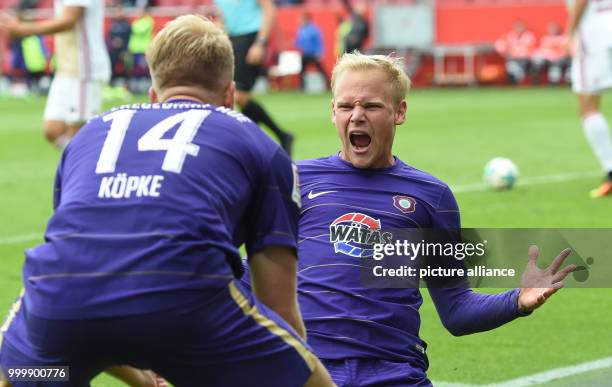 Aue's Sören Bertram celebreates with teammates after giving his side a 2:0 lead during the German 2nd Bundesliga soccer mathc between FC Ingolstadt...