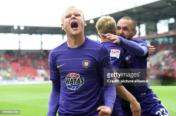 Aue's Sören Bertram celebreates with teammates after giving his side a 2:0 lead during the German 2nd Bundesliga soccer mathc between FC Ingolstadt...