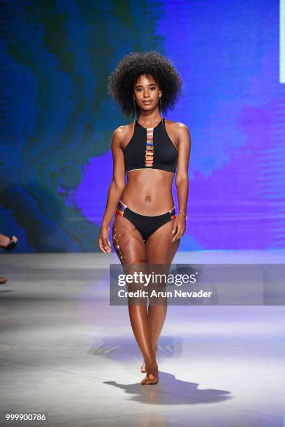 Model walks the runway for Pikai Swimwear at Miami Swim Week powered by Art Hearts Fashion Swim/Resort 2018/19 at Faena Forum on July 15, 2018 in...