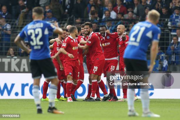 Duisburg's Kingsley Onuegbu celebrates with teammates after scoring a goal during the German 2nd Bundesliga soccer match between Arminia Bielefeld...