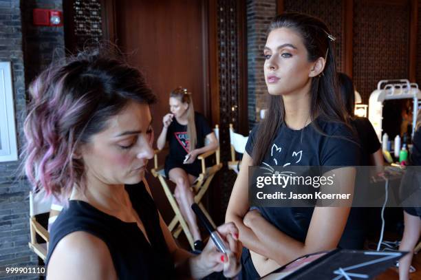 Model prepares backstage for Fashion Palette Miami Australian Swim Show SS19 at The Setai Miami Beach on July 15, 2018 in Miami Beach, Florida.