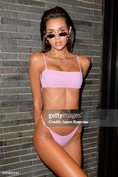 Model prepares backstage for Fashion Palette Miami Australian Swim Show SS19 at The Setai Miami Beach on July 15, 2018 in Miami Beach, Florida.