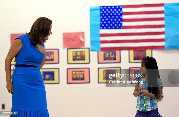 Mexican first lady Margarita Zavala talks with a second grader during a physical education class as she visits New Hampshire Estates Elementary...