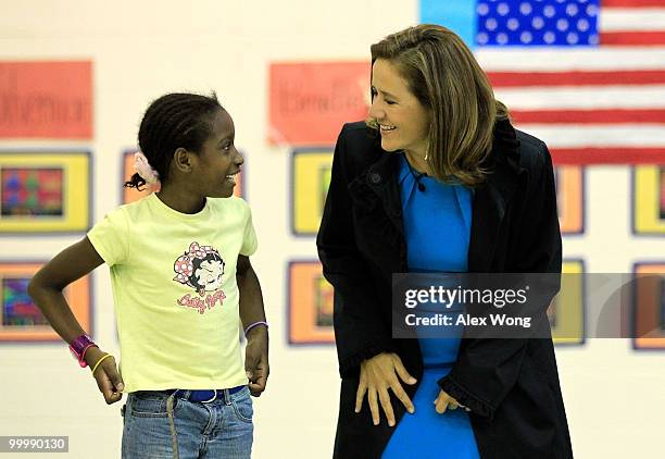 Mexican first lady Margarita Zavala talks with second grader Stephanie Mveng during a physical education class as she visits New Hampshire Estates...