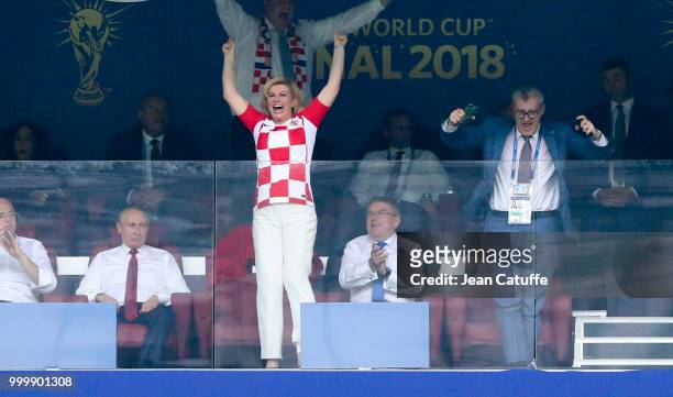 President of Croatia Kolinda Grabar-Kitarovic celebrates the first goal for Croatia with President of Croatian Football Federation Davor Suker while...