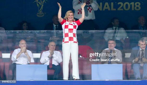 President of Croatia Kolinda Grabar-Kitarovic celebrates the first goal for Croatia while FIFA President Gianni Infantino, President of Russia...