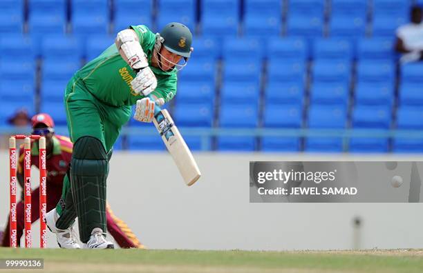 South African cricket team captian Graeme Smith plays a shot off West Indies bowler Kemar Roach during the first T20 match between West Indies and...