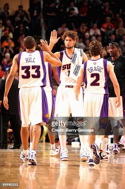 Grant Hill, Robin Lopez and Goran Dragic of the Phoenix Suns celebrate a play during the game against the New Orleans Hornets on March 14, 2010 at US...