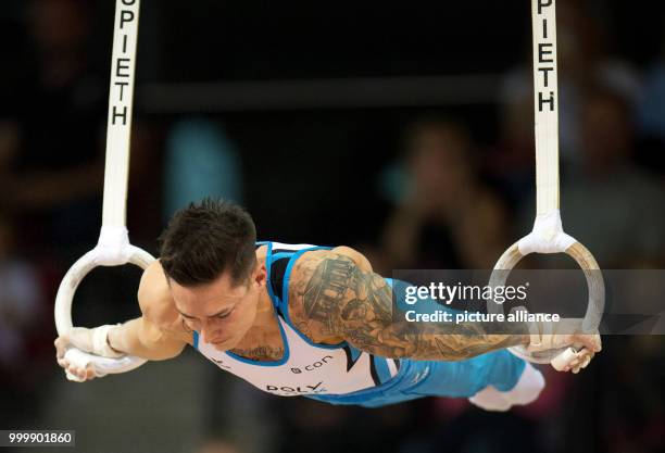 Dpatop - Marcel Nguyen in action on the rings during the national qualifying for the World Gymnastics Championships at the SCHARRena in Stuttgart,...