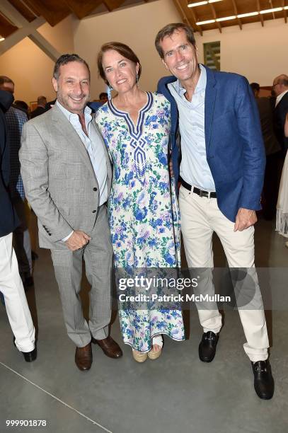 Alan Poul, Bryan Baldwin, and David Powers attend the Parrish Art Museum Midsummer Party 2018 at Parrish Art Museum on July 14, 2018 in Water Mill,...