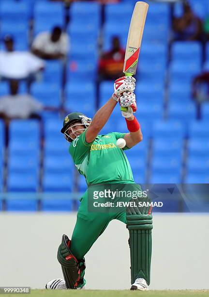 South African cricketer Jacques Kallis hits the ball off West Indies bowler Sulieman Benn during the first T20 match between West Indies and South...