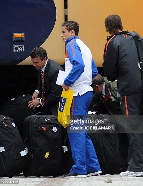 Dutch football player Ibrahim Afellay waits for his luggage as he arrives with Netherlands national football team at their training camp in Tirolian...