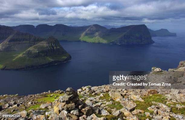 rugged landscape at villingardalsfjall and cape enniberg with vast views of surrounding fjords and islands - temas stock pictures, royalty-free photos & images