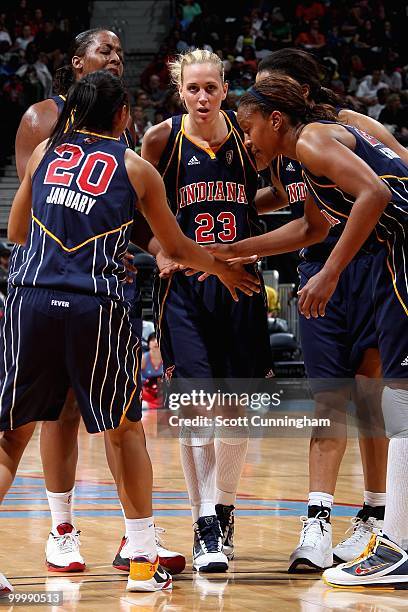 Katie Douglas of the Indiana Fever huddles with her teammates during the WNBA game against the Atlanta Dream on May 16, 2010 at Philips Arena in...