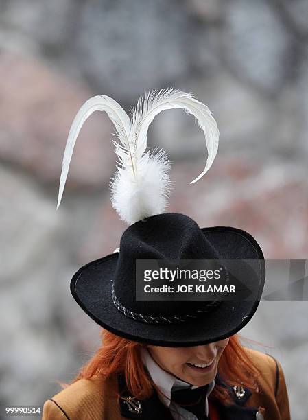 Musician from a Tyrolian brass band waits for the arrival of Netherlands national football team at their training camp in Tirolian village of Seefeld...