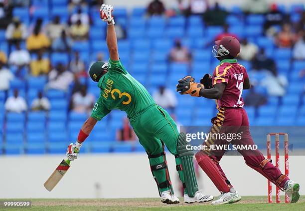 South African cricketer Jacques Kallis avoids a bouncer off West Indies bowler Darren Sammy as wicketkeeper Andre Fletcher fields during the first...