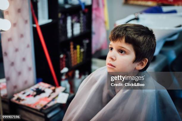 boy having haircut in hairdressing - click&boo stock pictures, royalty-free photos & images