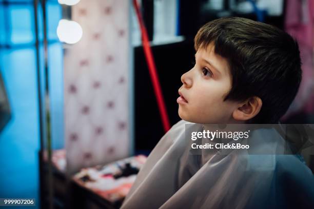 boy having haircut in hairdressing - click&boo stock pictures, royalty-free photos & images