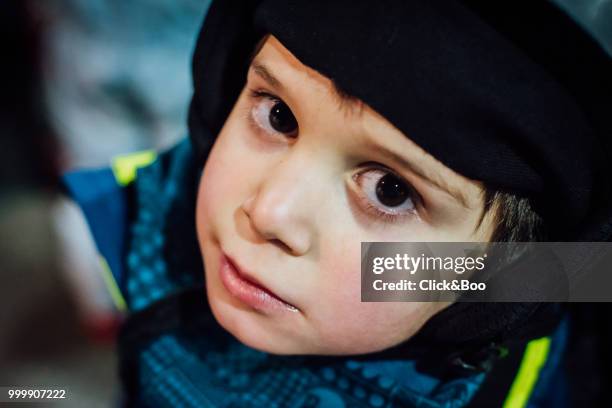 little boy dressed in ski clothes - click&boo stock pictures, royalty-free photos & images