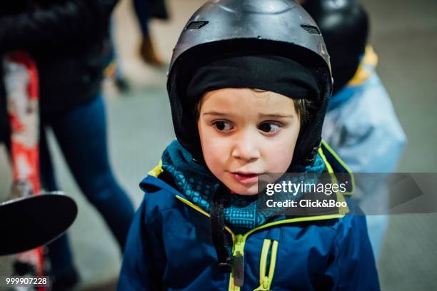 little boy dressed in ski clothes - click&boo bildbanksfoton och bilder