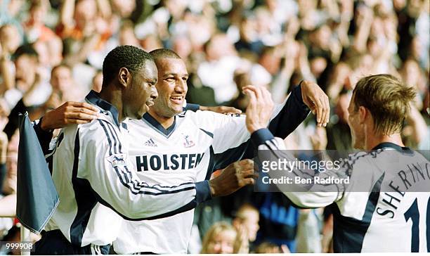 Dean Richards of Tottenham Hotspur celebrates scoring the first goal with Teddy Sheringham and Ledley King during the FA Barclaycard Premiership...