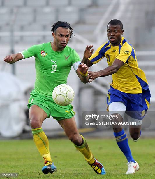 Togolese Thomas Dossevi vies with Gabonese Thierry Issiemon during the friendly football match for the Corsica cup, Togo vs Congo, on May 19 at the...