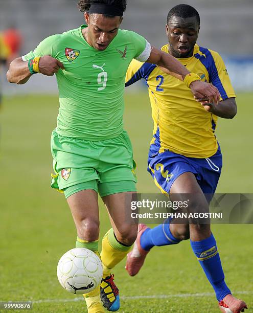 Togolese Thomas Dossevi vies with Gabonese Alassane Edou Yebe during the friendly football match for the Corsica cup, Togo vs Congo, on May 19 at the...