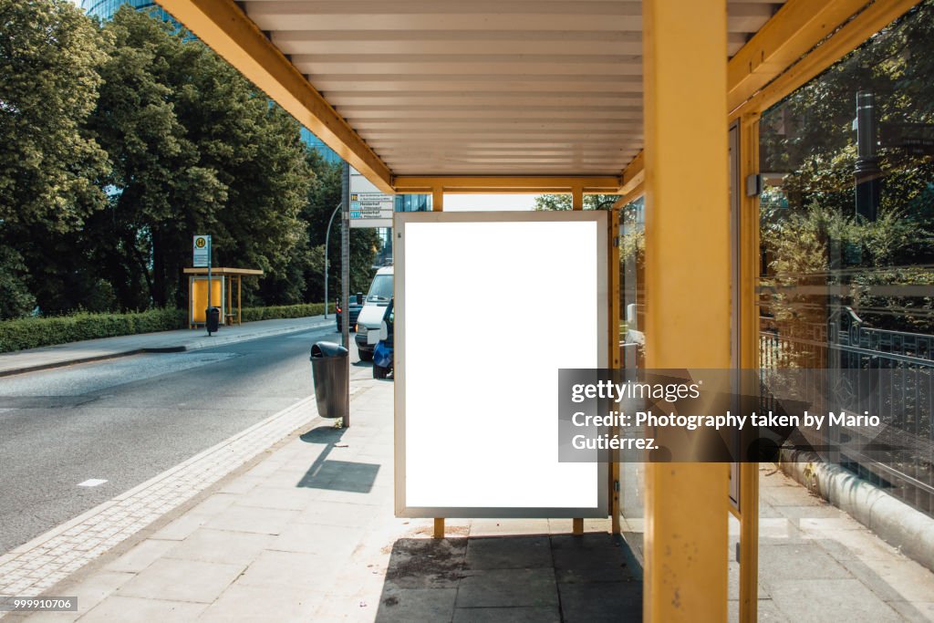 Bus stop with blank billboard