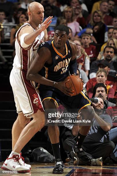 Tyler Hansbrough of the Indiana Pacers looks to move the ball against the Cleveland Cavaliers during the game at Quicken Loans Arena on April 9, 2010...
