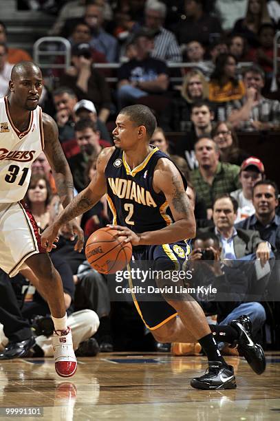 Earl Watson of the Indiana Pacers looks to move the ball against Jawad Williams of the Cleveland Cavaliers during the game at Quicken Loans Arena on...