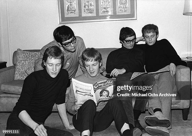 The British Rock and Roll group Manfred Mann relax in a hotel room circa 1965 in New York City, New York.