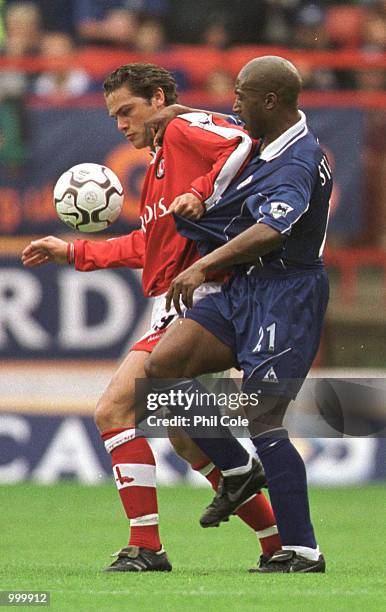 Luke Young of Charlton is challenged by Dean Sturridge of Leicester during the FA Barclaycard Premiership match between Charlton Athletic and...