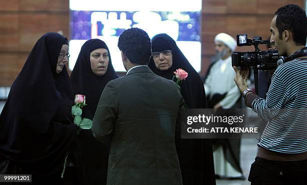 Laura Fattal , Nora Shourd and Cindy Hickey , mothers of US hikers detained in Iran, speak to the press upon their arrival at the Imam Khomeini...