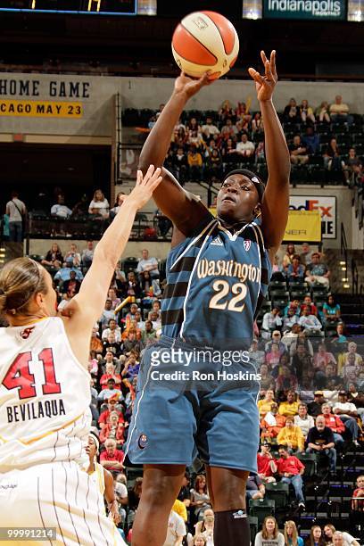Matee Ajavon of the Washington Mystics takes a shot against Tully Bevilaqua of the Indiana Fever during the WNBA game on May 15, 2010 at Conseco...