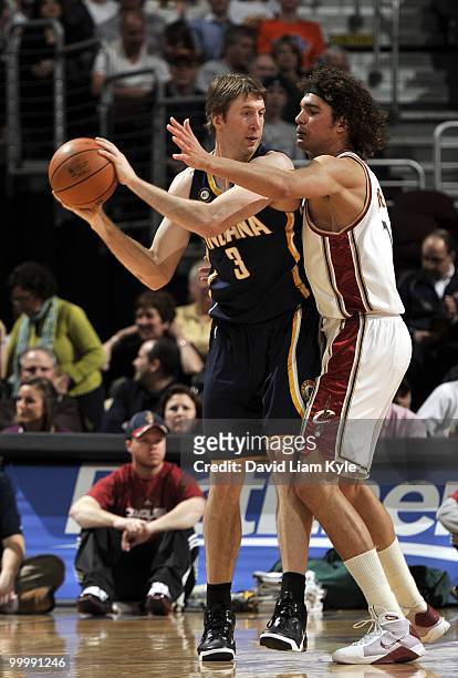 Troy Murphy of the Indiana Pacers looks to move the ball against the Cleveland Cavaliers during the game at Quicken Loans Arena on April 9, 2010 in...