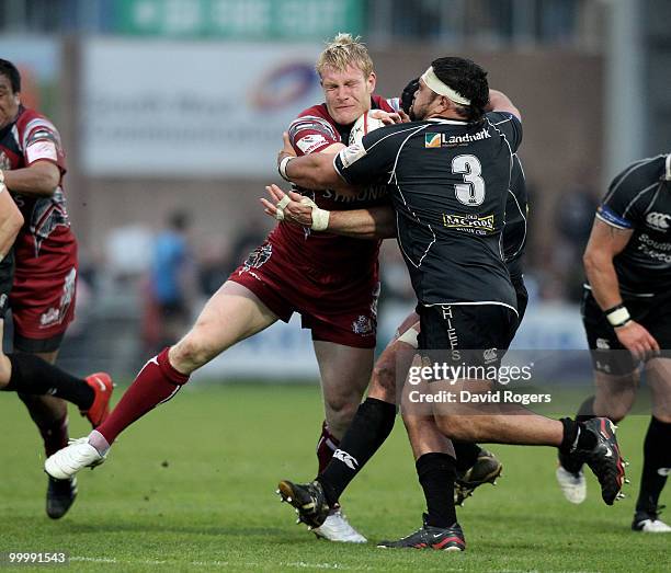 Lee Robinson of Bristol is tackled by Hoani Tui during the Championship playoff final match, 1st leg between Exeter Chiefs and Bristol at Sandy Park...