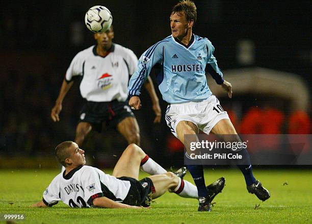 Sean Davis of Fulham tries to tackle Teddy Sheringham during the Worthington Cup, 4th Round between Fulham and Tottenham Hotspur at Craven Cottage,...