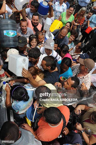 Dairy farmers distribute free milk during a demonstration on May 19, 2010 in Medellin, Antioquia department, Colombia, against a free trade agreement...